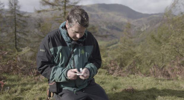 Barnaby Wylder inspects a sample 