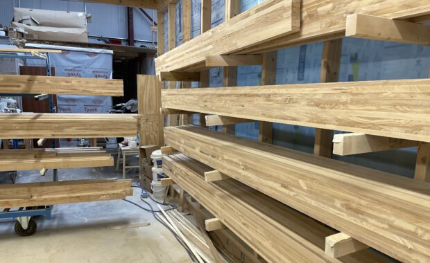 Stacks of planks made out of ash in a sawmill 