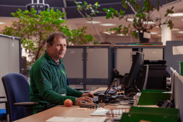 Person working at a desk in an office.